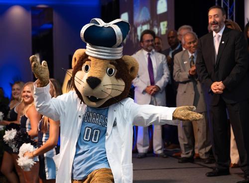 ODU Monarch wearing a white coat