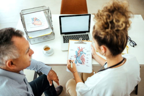 Doctor explains heart diagram to patient