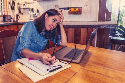 Stressed woman with laptop