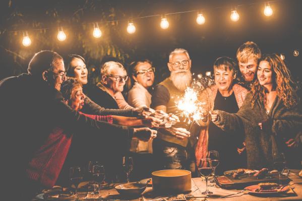 People celebrate at party with sparklers