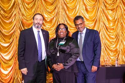 A photo of Dr. Alfred Abuhamad and Dr. LaConda Fanning holding a trophy. Dr. Abuhamad is presenting Dr. Fanning with the award in honor of her being selected as the winner of the President’s Champion of Diversity & Inclusion Award